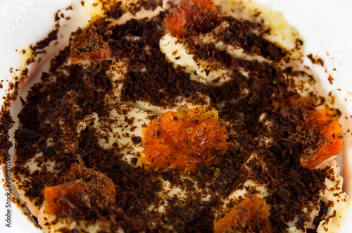 Curd dessert with dried apricots, top view, close-up
