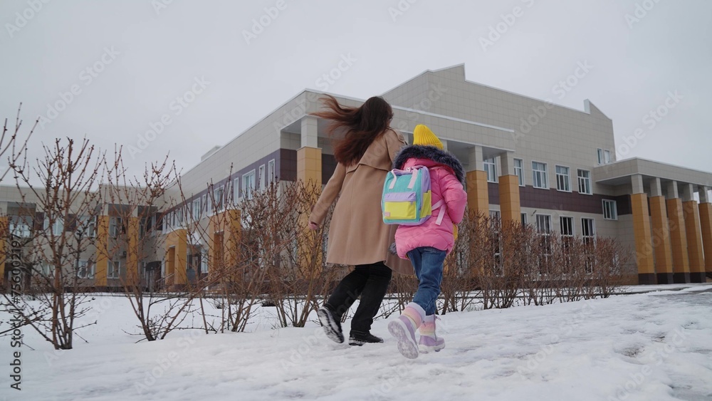 Fotka „child schoolboy runs holding his mother hand school, happy