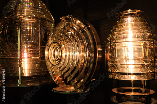 Obraz na płótnie Close view of different Fresnel lens for lighthouses, lights on in w salonie