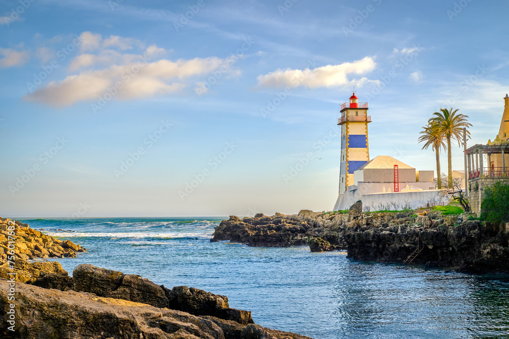 Colorful day on sea shore and Santa Marta lighthouse in Cascais