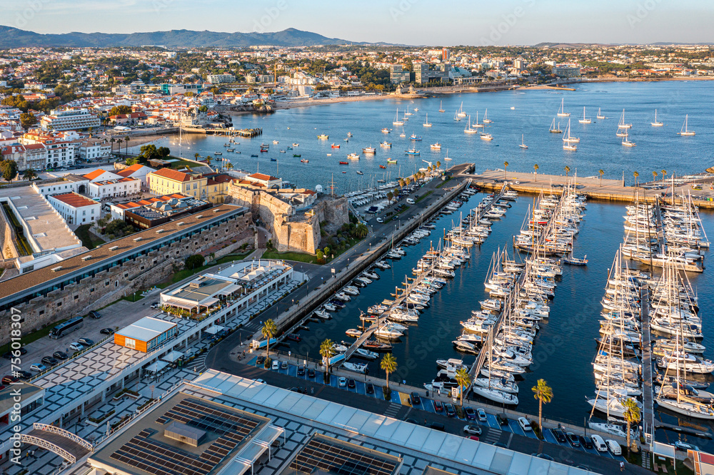 Fototapeta premium Drone view of marina, yachts and sailboats at sunset, Cascais