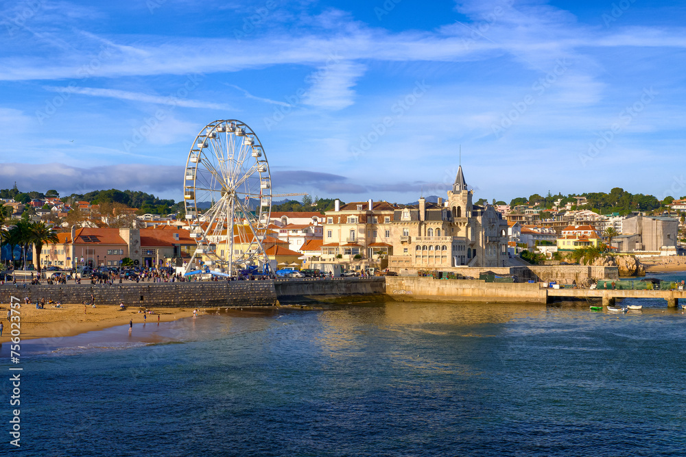 View of Cascais, Portugal, coastline and beach with Ferris wheel on