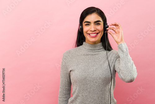 Latin customer service agent smiling working at the call center