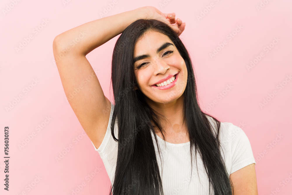 Excited happy latin woman smiling looking relaxed Excited happy latin woman smiling looking relaxed