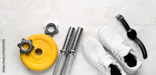 Barbell plates, shoes, watches, grips and clamps on white background © Pixel-Shot