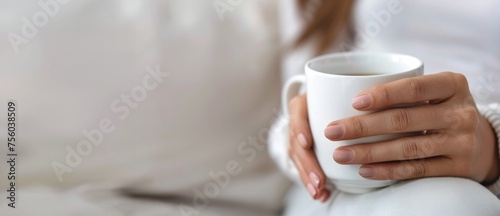 close up of female's hands holding a white mug, banner with copy space
