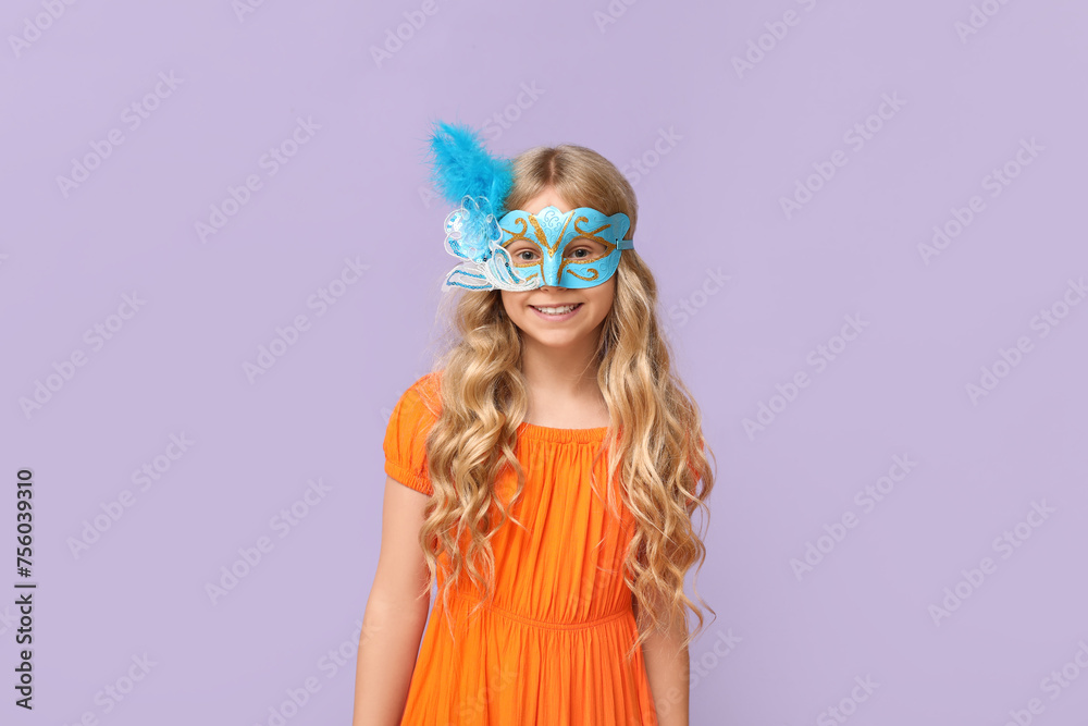 Happy little girl wearing carnival mask on lilac background Happy little girl wearing carnival mask on lilac background