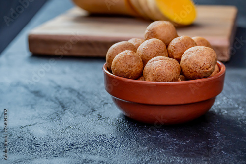 Freshly cooked pumpkin fritters on a table.