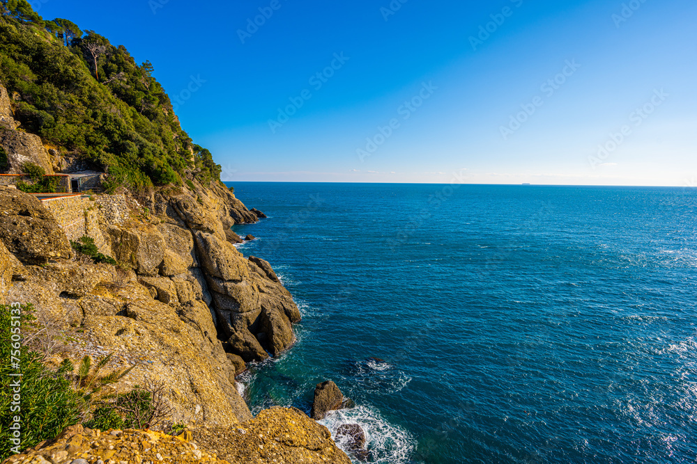 Rugged Cliffs and Endless Blue: The Mediterranean Coastline near Portofino, Italy Rugged Cliffs and Endless Blue: The Mediterranean Coastline near Portofino, Italy