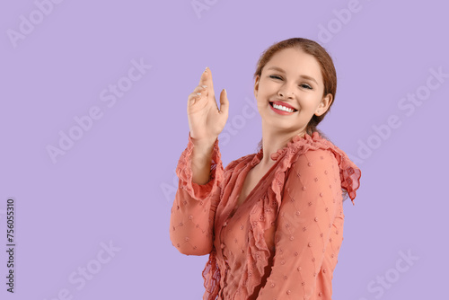Smiling young redhead woman...
