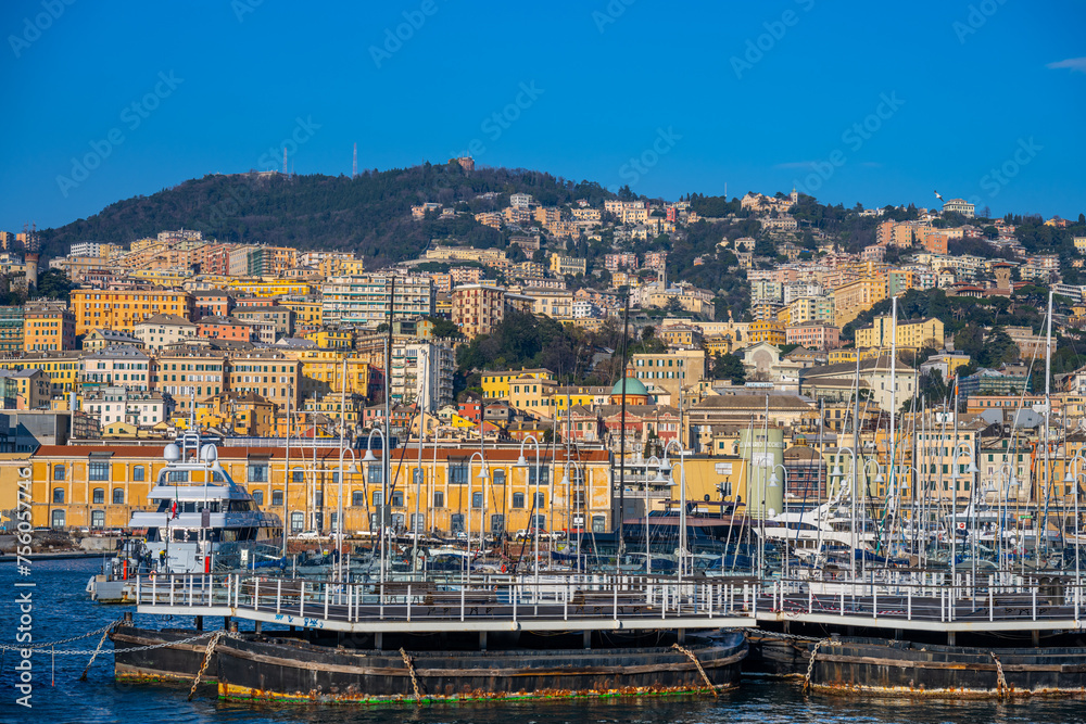 Sunlit Marina and Colorful Hillside Architecture in Genoa, Italy