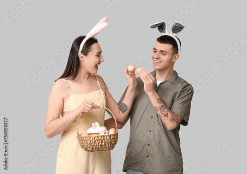 Happy young couple with Eas...