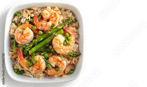 Top view of risotto, rice with shrimp, asparagus and vegetables in a square ceramic bowl. Concept of healthy eating, sea food, Italian cuisine. Isolated on a white background. Copy space for text, ad