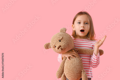 Shocked little girl with te...