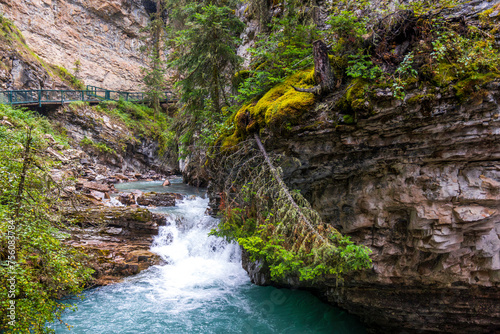  scenic view of a waterfall in Johnston canyon, Banff, Alberta, canada