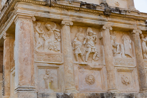 Closeup of figured marble reliefs of antique temple Sebasteion with mythological, allegorical and imperial subjects in ancient city of Aphrodisias, Turkey photo
