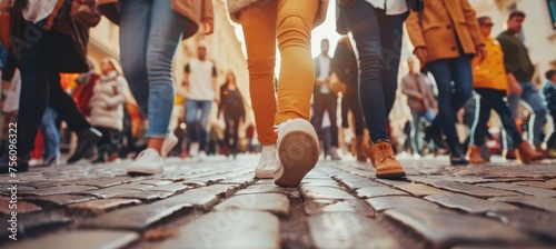 Urban crowd walking on city street, focus on legs in stylish shoes against urban backdrop