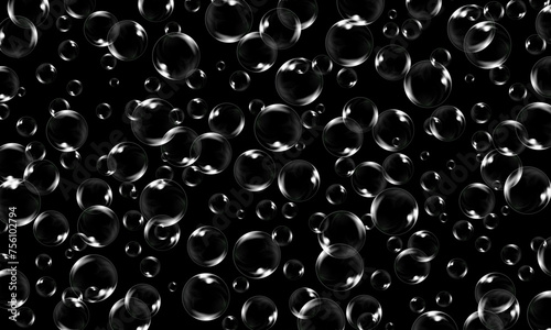 Air soap bubbles on a black background.