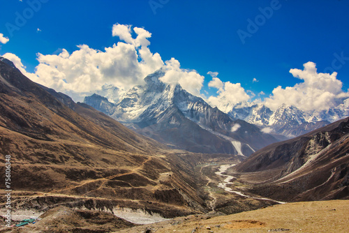 Sweeping himalayan vistas with Ama Dablam rising dramatically over the Dudh kosi river and khumbu valley in Nepal photo
