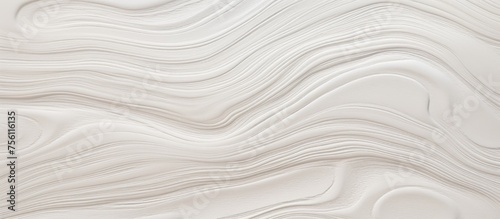 A detailed closeup of a white marble texture resembling waves, with a liquidlike appearance. The pattern is reminiscent of an aeolian landform