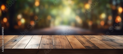 Empty wooden table with blurred background for product display montage.