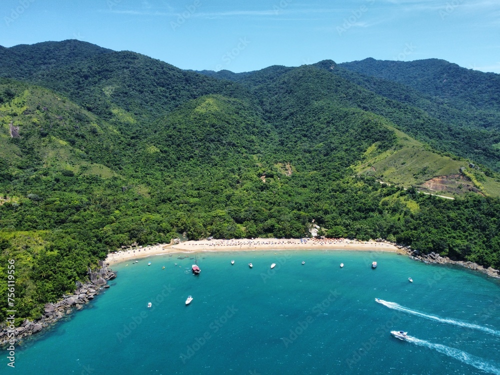 aerial photo of paradisiacal blue beach with clear sand aerial photo of paradisiacal blue beach with clear sand