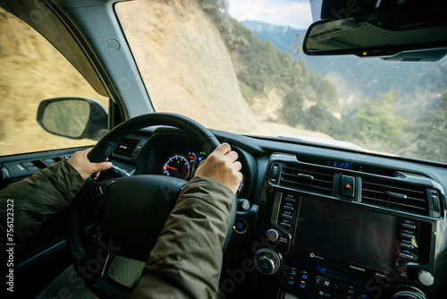  Driving car on the high altitude mountain trail in tibet,China photo