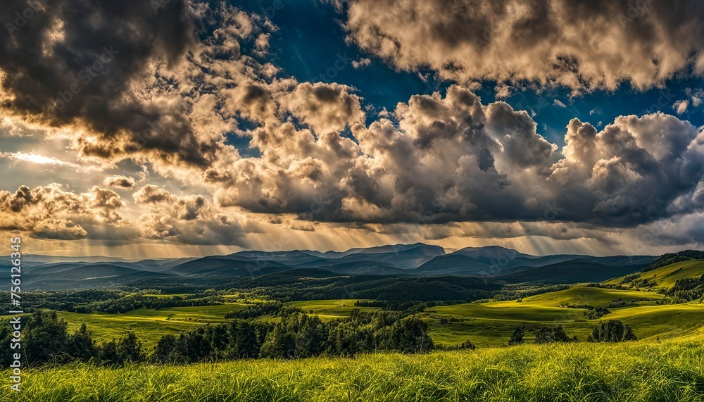 Fototapeta premium Radiant Sunbeams Over Rolling Hills