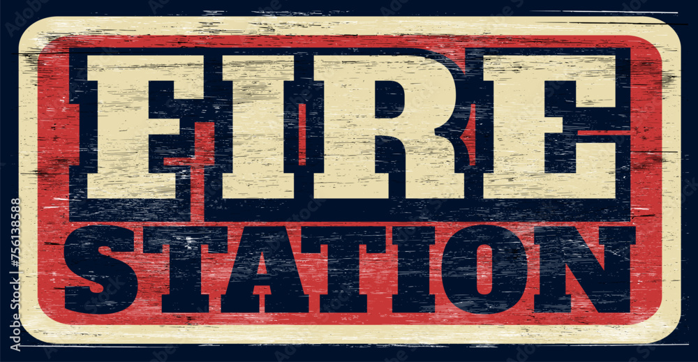 Fototapeta premium Aged and worn retro fire station sign on wood