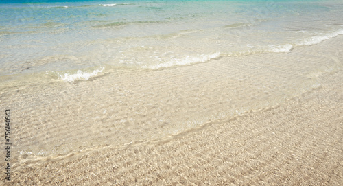 Clear water at the beach on a tropical island Crystal clear turquoise water under a blue sky