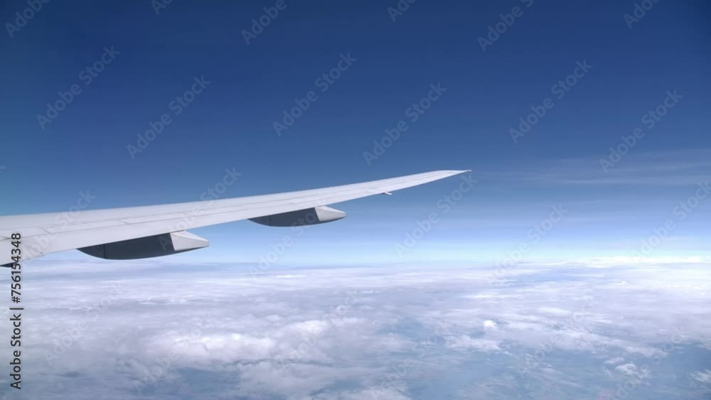 Long Slick Airplane Wing in Flight, Passenger View from the Window Long Slick Airplane Wing in Flight, Passenger View from the Window