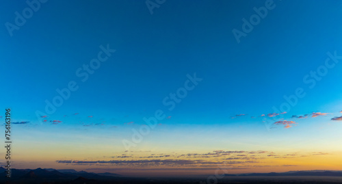 Enjoy panoramic views of the skyline . Sunset in the evening sky with colorful clouds and beautiful cloud patterns Amidst the soft golden light   © Photo Sesaon