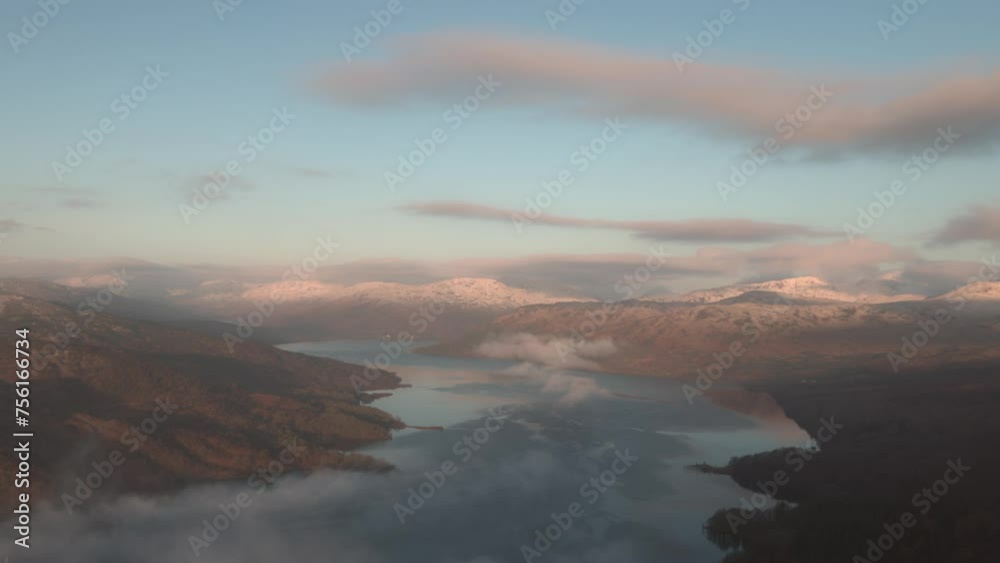 Static shot of loch Katrine from Ben A'an with snowy mountain tops at winter