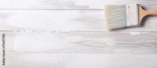 Painting apartment walls with a white paintbrush - blank area for text.