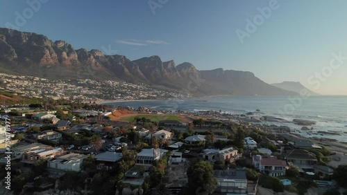 Foggy Twelve Apostles Mountain Seen From Clifton 4th Beach In Cape Town, South Africa. drone ascending shot photo