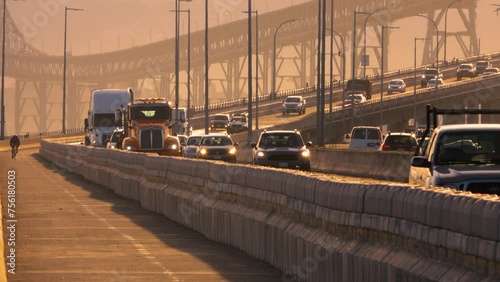 Automobile bridge curve with traffic and bicycle rider