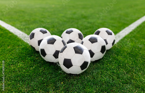 Soccer balls sitting on the corner of the soccer field. Good soccer concept photo or soccer tournament photo