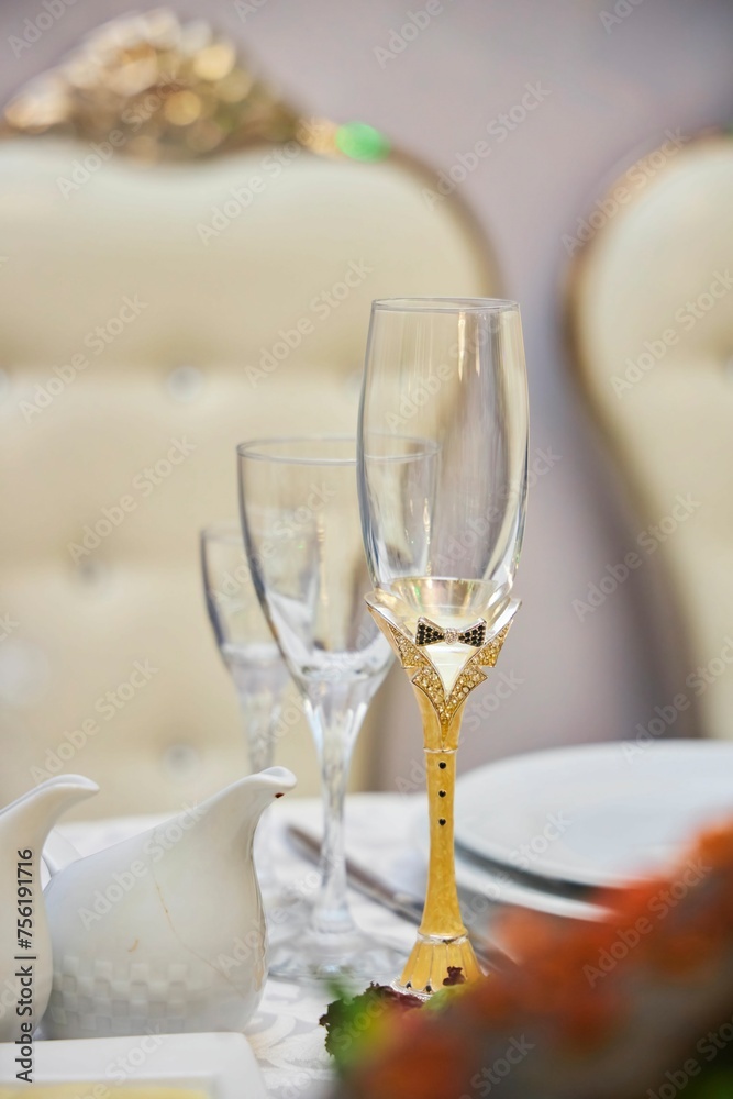 Festive drinks glasses for the newlyweds. The wedding table Festive drinks glasses for the newlyweds. The wedding table