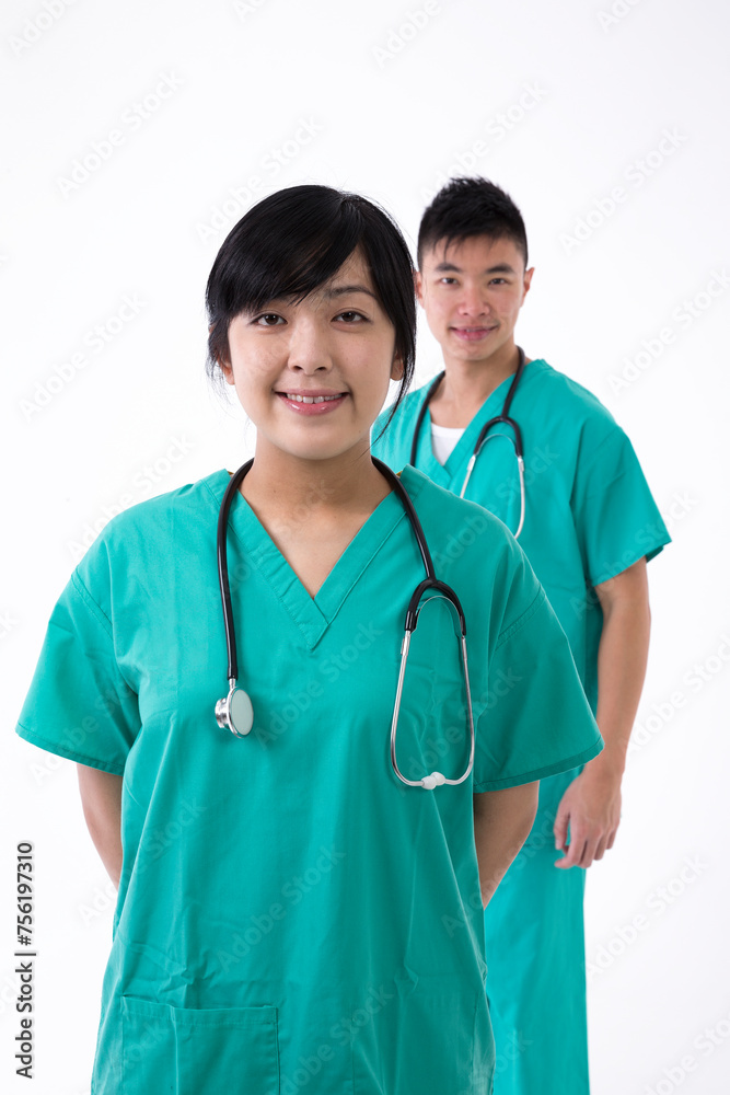 Asian healthcare workers wearing medical scrubs. Asian healthcare workers wearing medical scrubs.