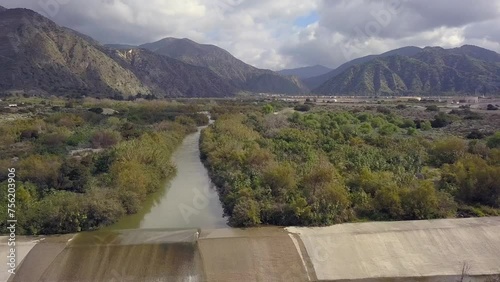 Aerial view of the upper San Gabriel riverbed as it heads south towards the ocean, Drone heads north towards the Angeles National Forest in Azusa, CA photo