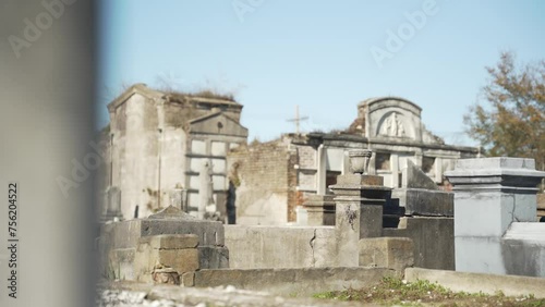 Cracking and decaying unkempt graveyard photo