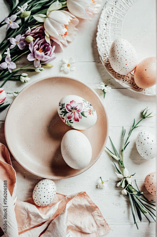 Easter still life: painted Easter eggs on the table, top view.