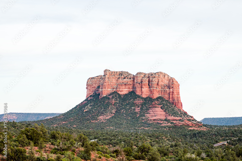 sedona courthouse rock bell rock blue puffy clouds sun bright light