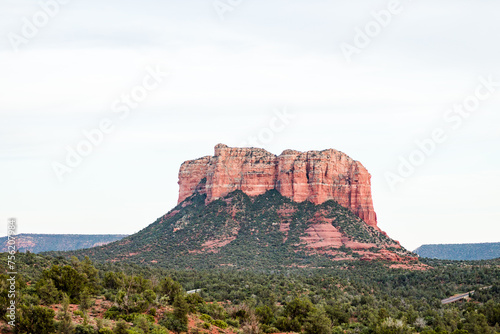 sedona courthouse rock bell rock blue puffy clouds sun bright light