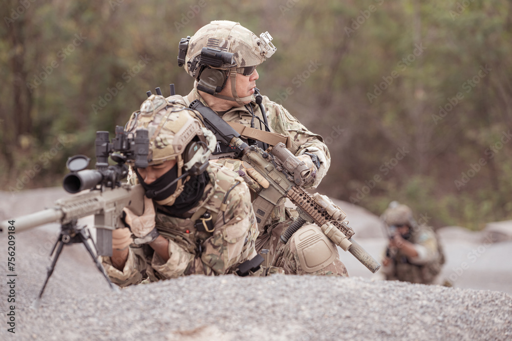 Soldiers in camouflage military uniforms carrying weapons, Reconnaissance missions in rugged mountains, Assault infantry battle training.