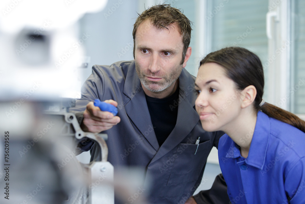 team of two working in factory team of two working in factory