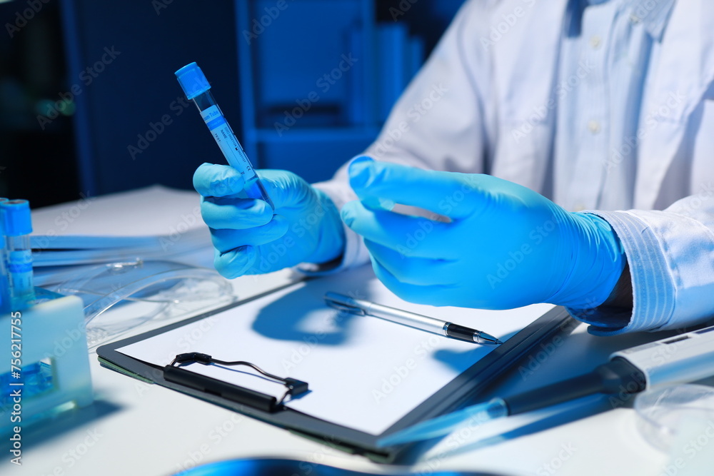 A researcher is testing a new chemical in a test tube that has just been discovered by a famous scientist, A chemist sits in a well-equipped laboratory and seriously examines test tubes. A researcher is testing a new chemical in a test tube that has just been discovered by a famous scientist, A chemist sits in a well-equipped laboratory and seriously examines test tubes.