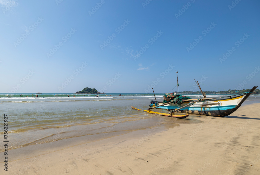 Weligama, February 14, 2024. Boats on Weligama City Beginner's Surf beach on the southern coast of Sri Lanka