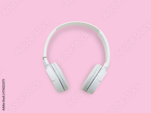 White headphone pink background.