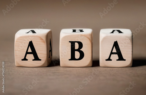 Abbreviation ABA on wooden cubes